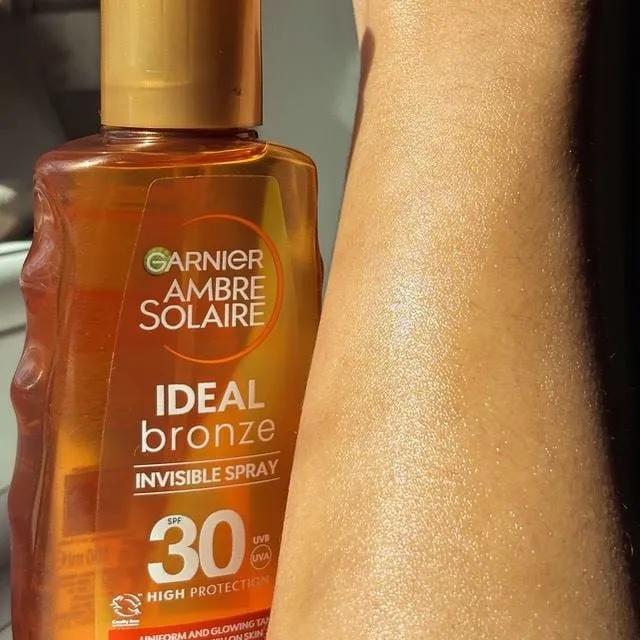 Garnier amber solaire spf protecting spray bottle which is